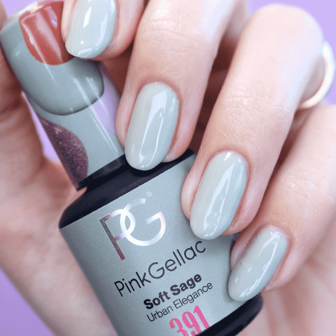 Feminine hand with soft sage green nail polish, holding a bottle of Pink Gellac Soft Sage color.
