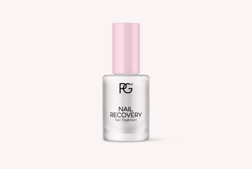 Bottle of nail care product with pink cap and inscription "Nail Recovery Nail Treatment".