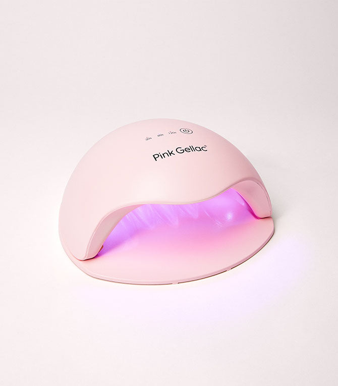 Pink LED nail dryer from Pink Gellac with light on the inside.