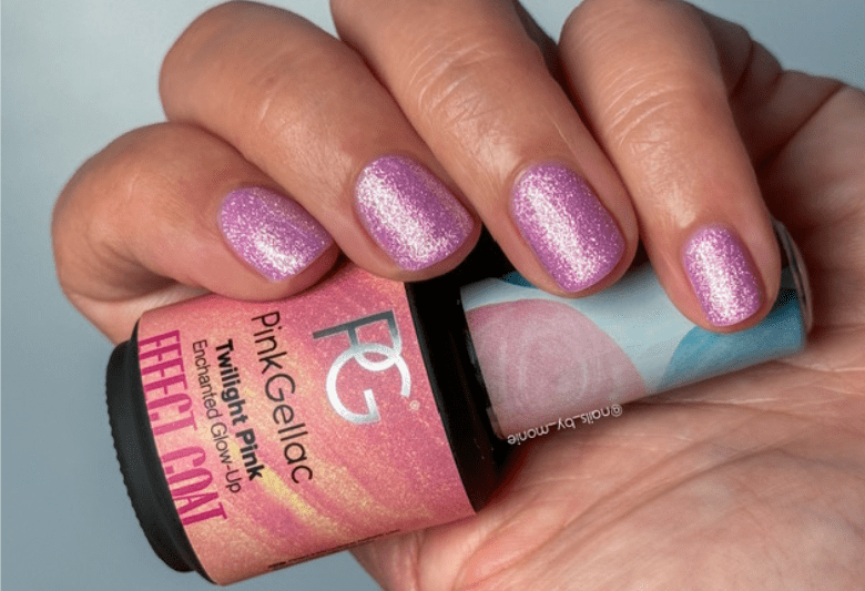 Hand with shiny lilac nail polish and a bottle of Pink Gellac Twilight Pink Effect Coat.
