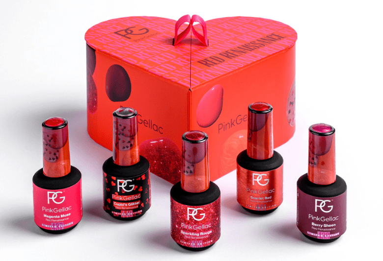 A heart-shaped gift box with the text "Red Berries" and five bottles of pink and red Pink Gellac nail polish in different shades displayed in front of it.
