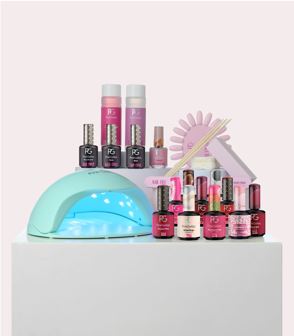 A collection of nail care products, including a UV LED lamp, several bottles of nail polish, nail files, a color fan, and other manicure supplies.