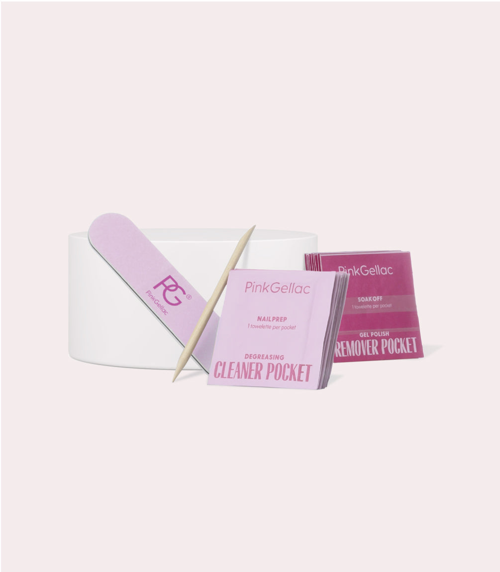 A nail care set with a file, wooden stick and various Pink Gellac products, such as Nail Prep and Remover Pockets.
