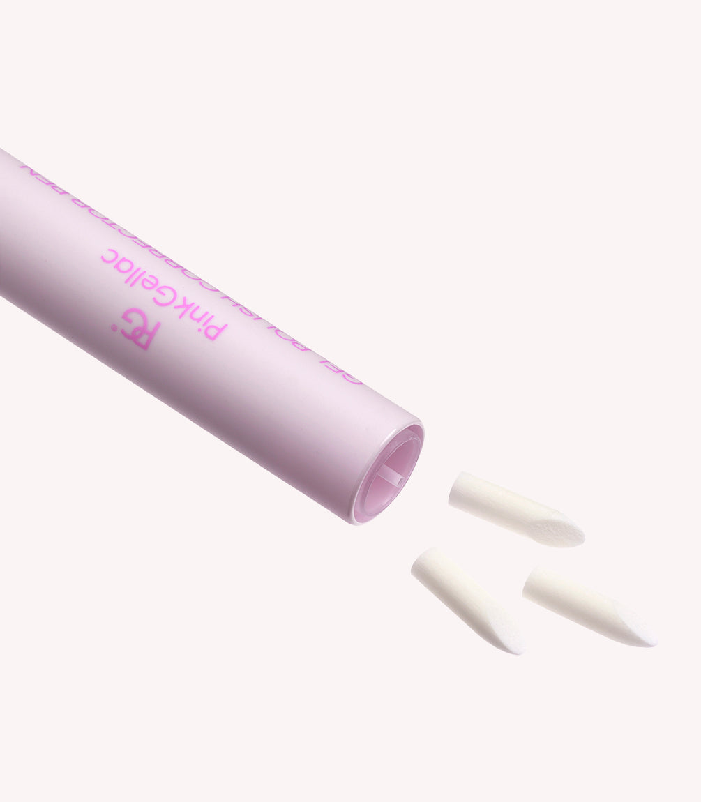 Pink pen with three interchangeable white attachments against a white background.