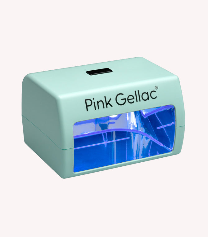 Mint green UV lamp with blue interior lighting, brand "Pink Gellac", used for nail hardening.