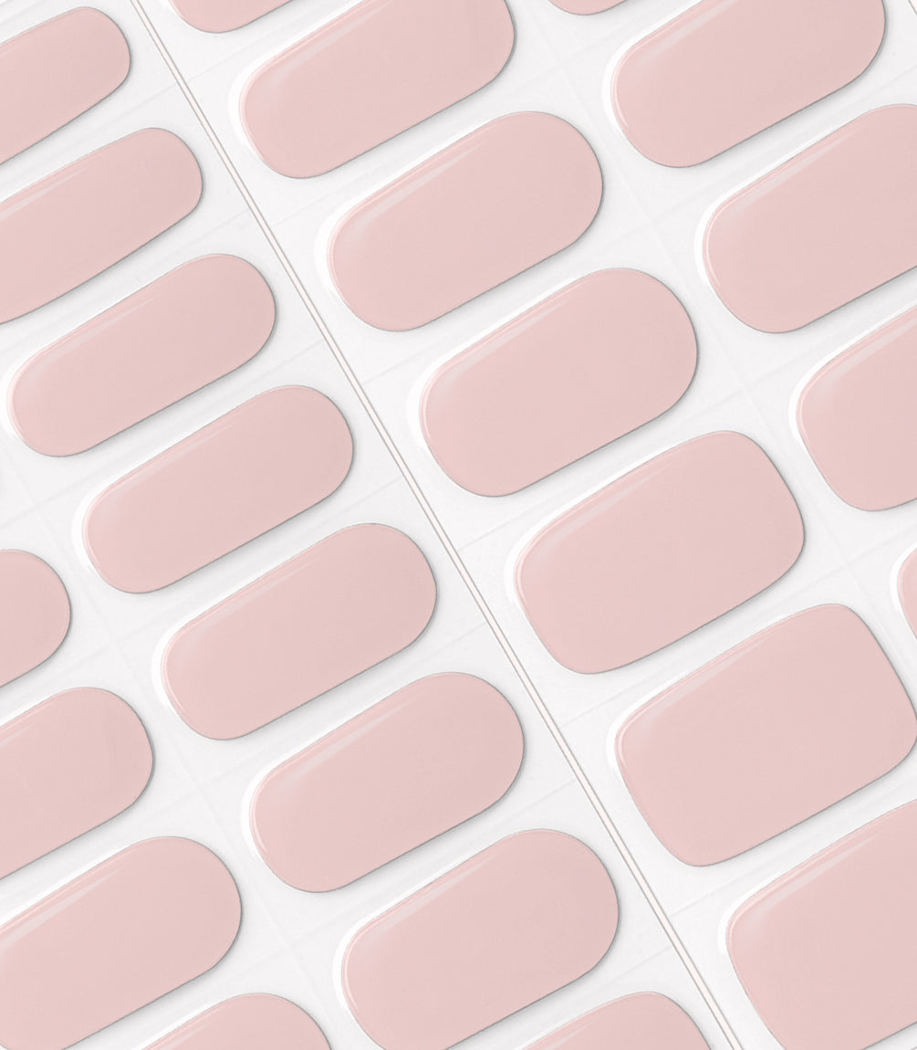 Image of pink oval nail stickers neatly arranged on a sheet.