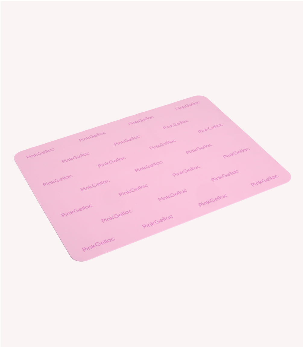 Pink silicone mat with repeated "PinkGellac" logo printed on it.