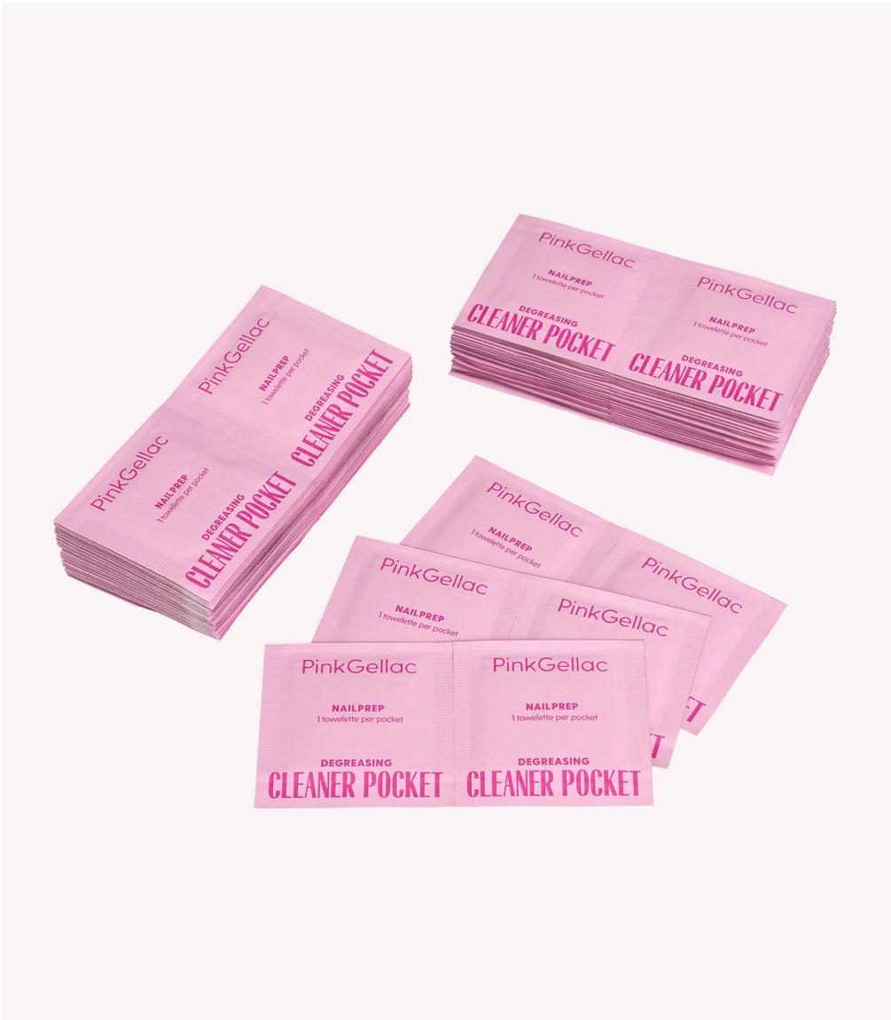 Piles of pink Pink Gellac Cleaner Pocket wipes for nail preparation.