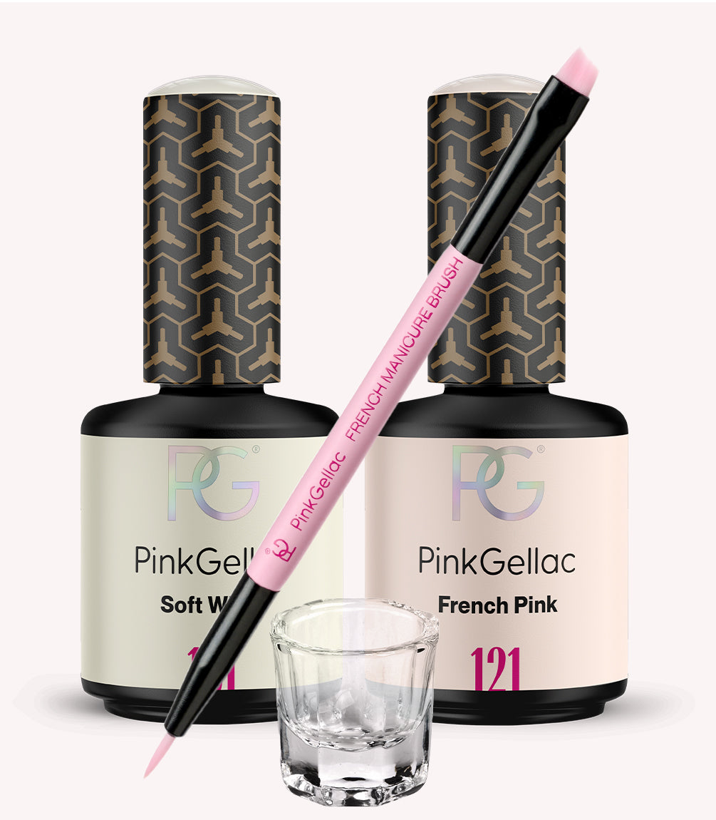 Two bottles of Pink Gellac nail polish in the colors Soft White and French Pink, with a French manicure brush and a small glass underneath.