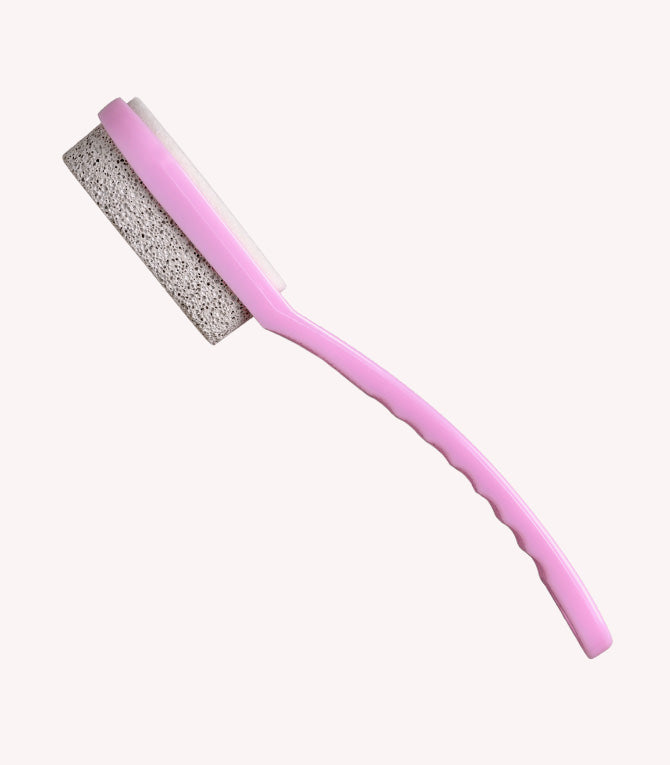 A pink pumice brush with a long handle and an abrasive stone at the end.