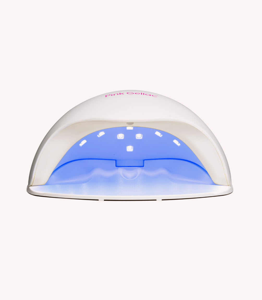 White UV LED lamp for nail drying with blue lights on the inside.