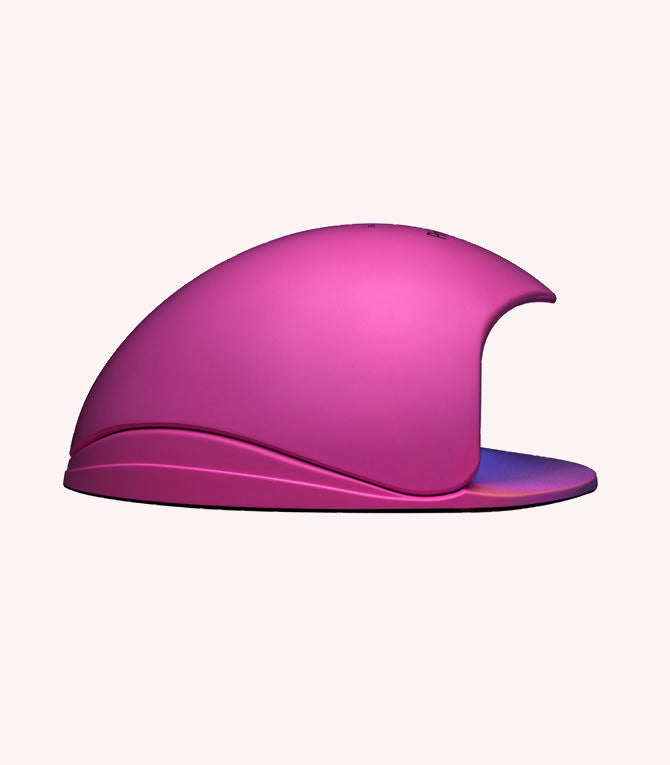 Pink, modern designed cat house with semi-circular top and open entrance.