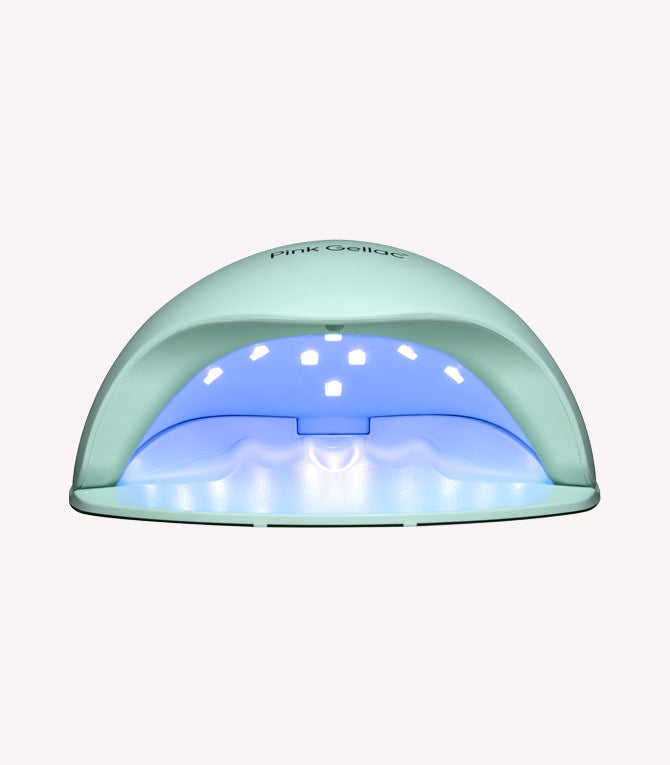 A hemispherical nail lamp with multiple LED lights, intended for curing gel polish.