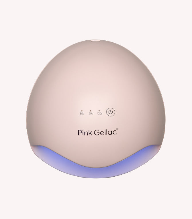 LED light for nails with the text "Pink Gellac" and an on/off button, illuminated at the bottom.