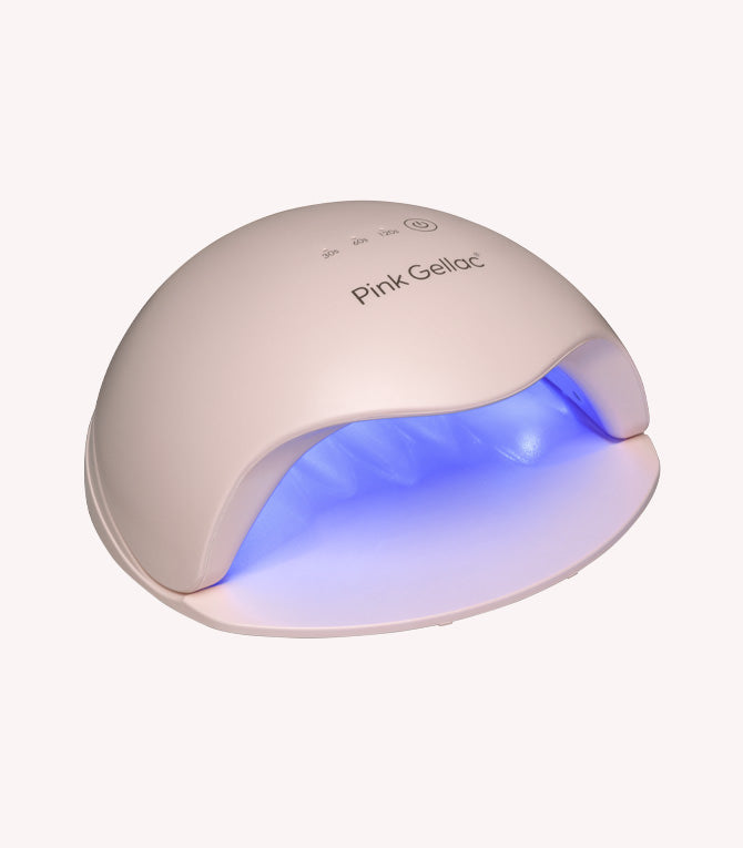 Beige LED nail lamp with brand name "Pink Gellac" and blue lighting inside.