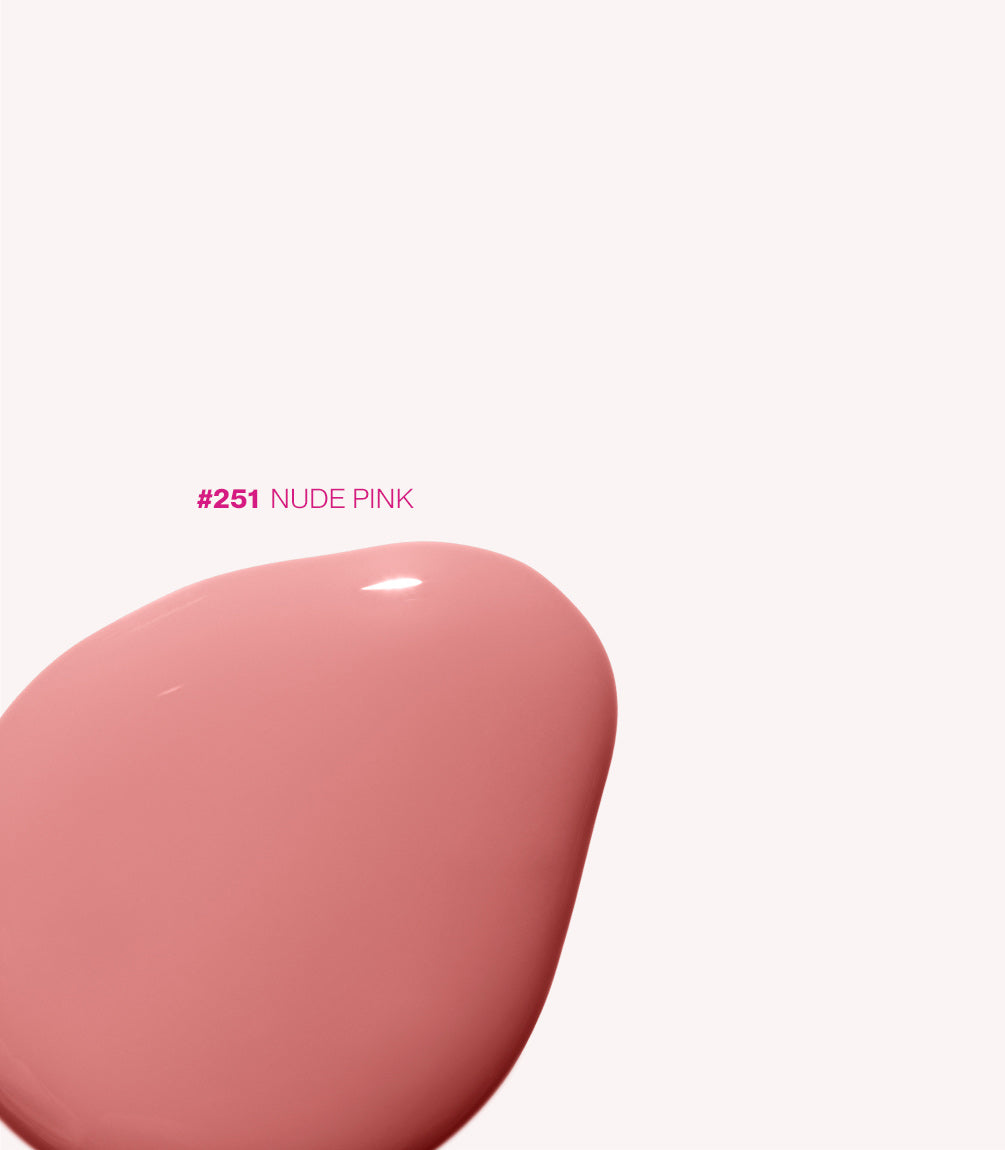 An image of a drop of pink nail polish in the color Nude Pink #251 on a white background.