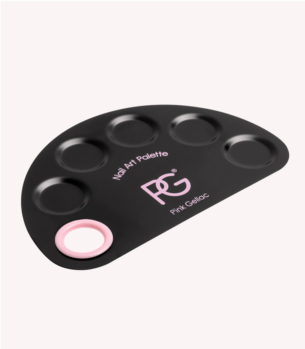 Black nail art palette with pink accents and six cutouts for paint.