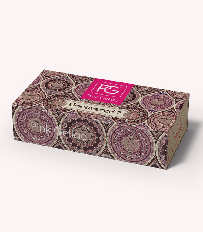 A decorative box with a mandala-like pattern and the text "Pink Gellac Uncovered 7" on the lid.