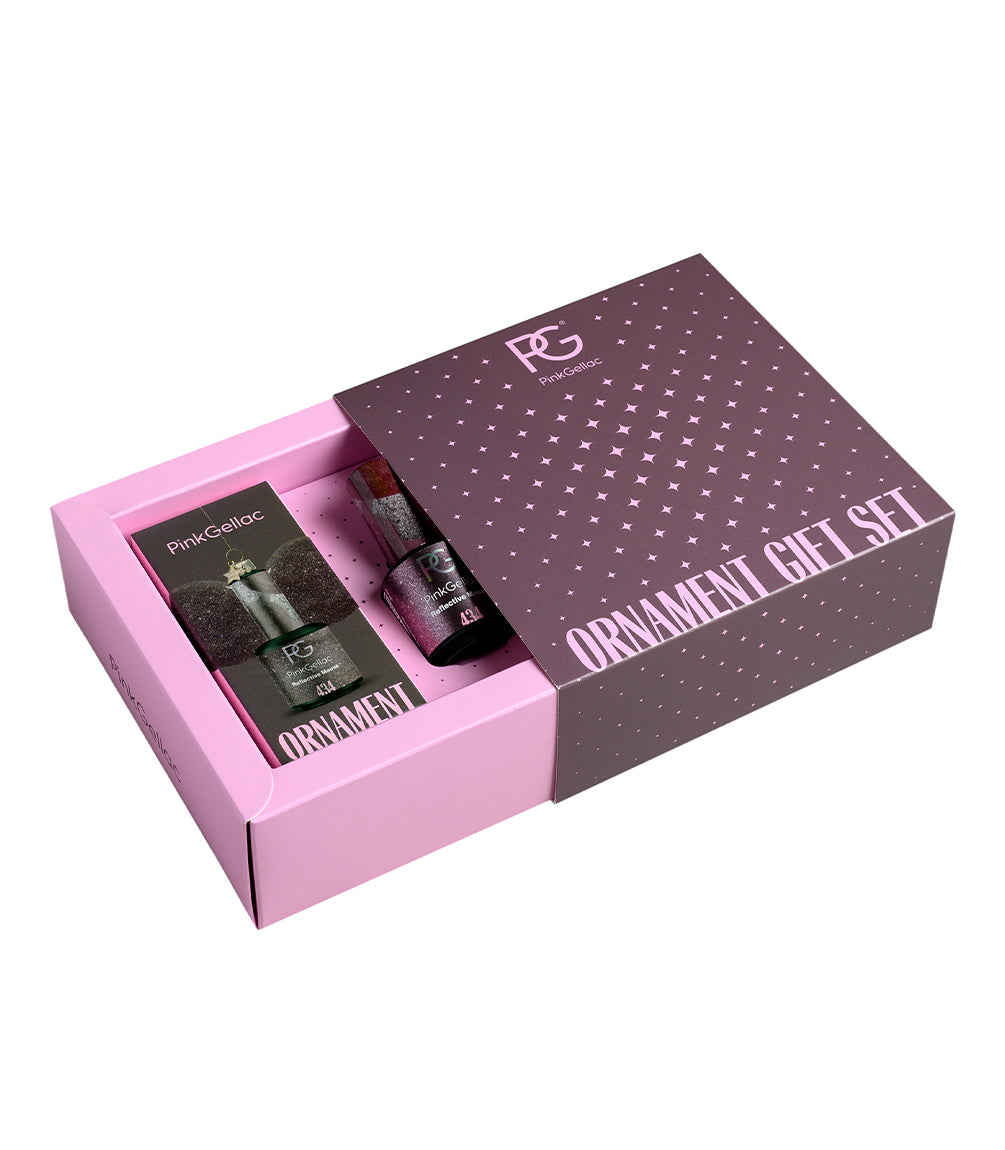 An open pink gift box with the text "ORNAMENT GIFT SET" on the lid, containing products from Pink Gellac.