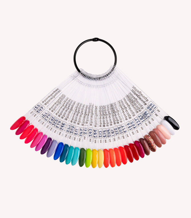 A fan of painted nail tips in different colors, attached to a black ring, with inscriptions on each stick.