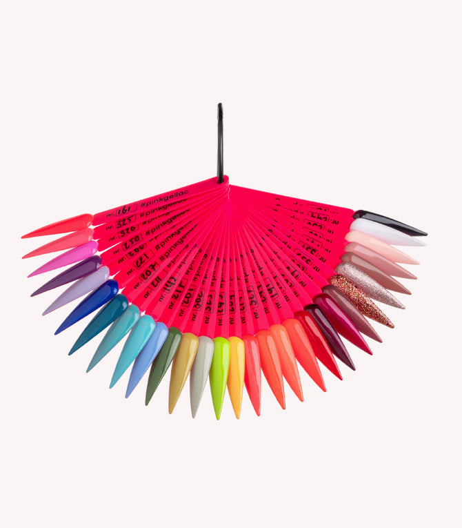 A range of artificial nails in various colors, ranging from neutral tones to bright and glittery colors, each with a neon pink holder.