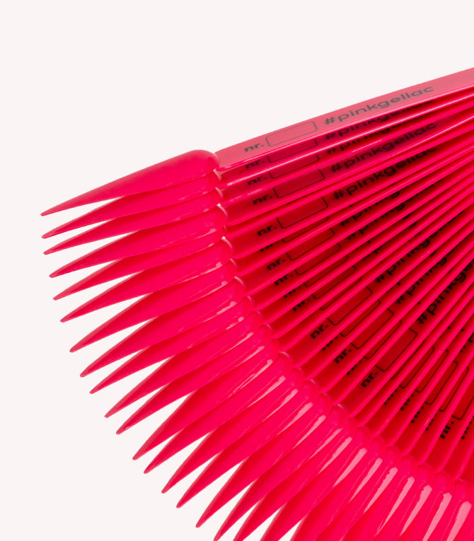 Pink fan-shaped displays with numbers and hashtags for showcasing colors, probably for nail polish.