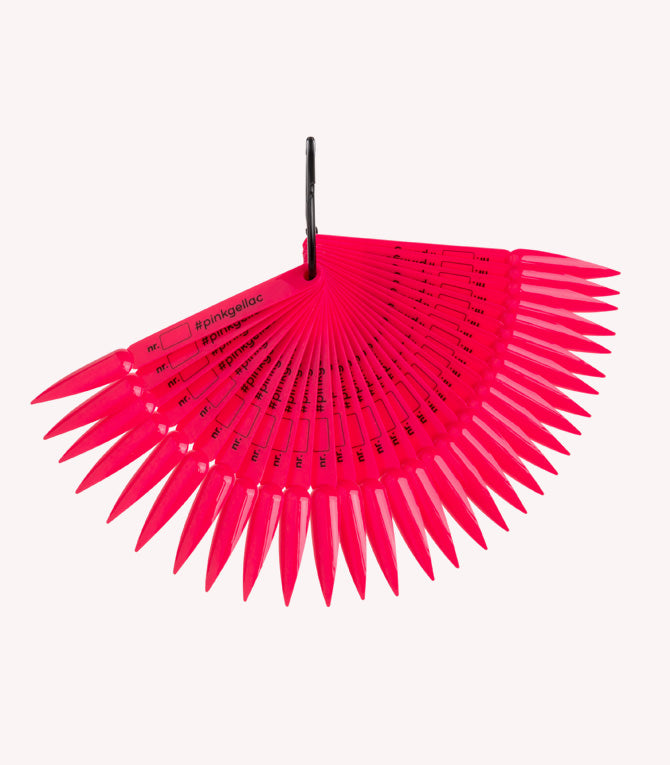 A fan of bright pink, pointed nail stickers labeled "#pinkgellac" and numbered, attached to a black ring.