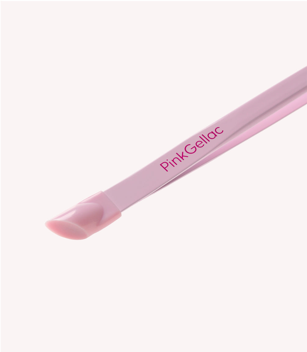 Pink cuticle pusher with the "Pink Gellac" logo on it.