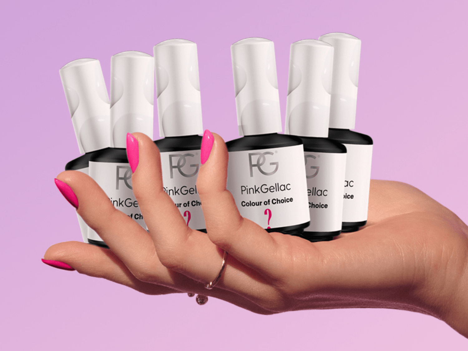 Hand with pink nails holds bottles of Pink Gellac against a pink background.