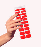 Hand wearing Pink Gellac 057 Bisou Red gel nail stickers.