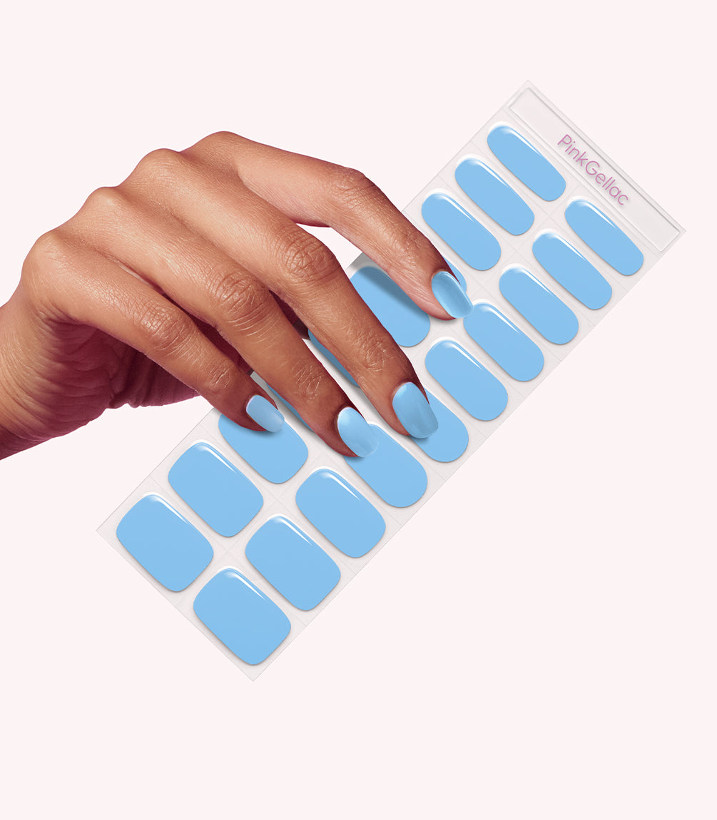 Hand wearing Pink Gellac 060 Ice Blue gel nail stickers.