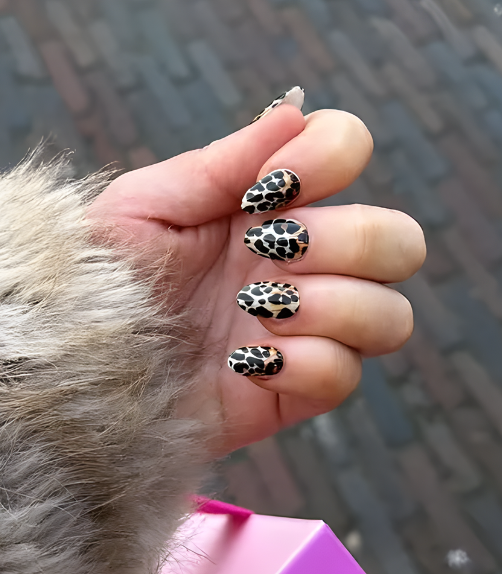 Hand wearing Pink Gellac 028 Lavish Leopard gel nail stickers.