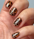 Close-up of a hand with Pink Gellac 028 Lavish Leopard gel nail stickers.