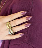 Hand wearing Pink Gellac 020 Sparkling Plum gel nail stickers.