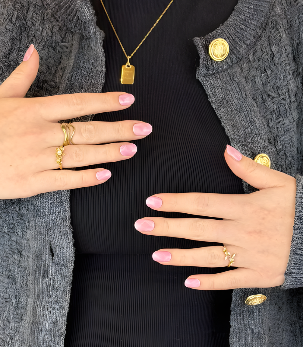 Hand wearing Pink Gellac 048 Marbled Pink gel nail stickers.