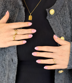 Hand wearing Pink Gellac 048 Marbled Pink gel nail stickers.