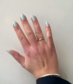 Hand wearing Pink Gellac 046 Aquatic Mint gel nail stickers.