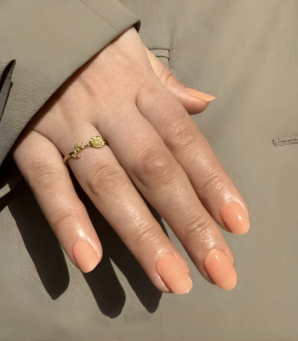 Hand wearing Pink Gellac 043 Soft Apricot gel nail stickers.