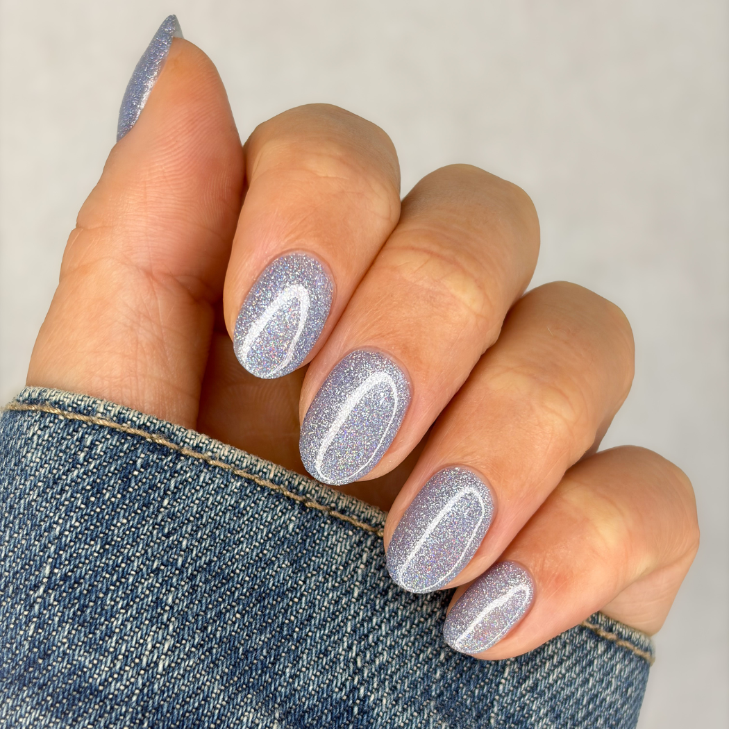 Manicured nails painted with Pink Gellac 489 Hologlaze Blue gel polish.