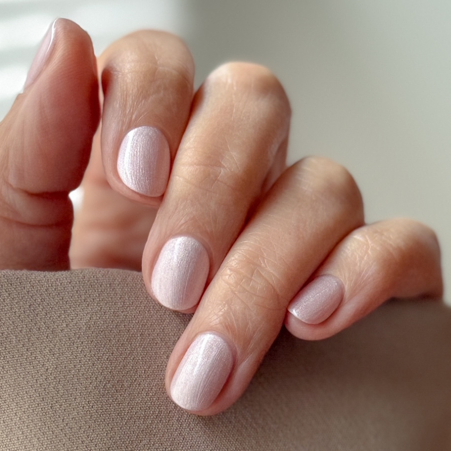 Manicured nails painted with Pink Gellac 492 Ivory Pearl gel polish.