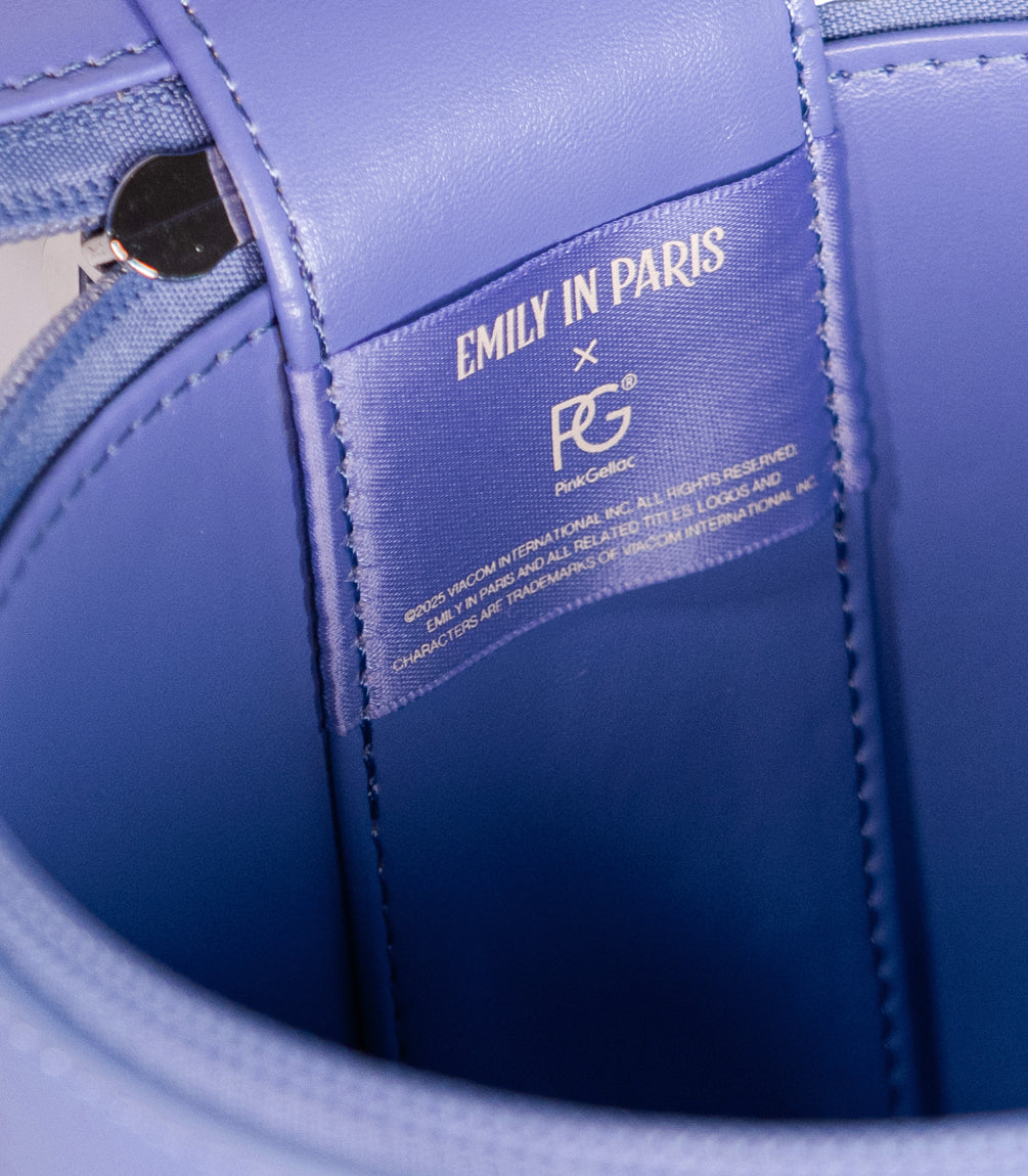 Logo detail on the Pink Gellac Emily in Paris travel case.