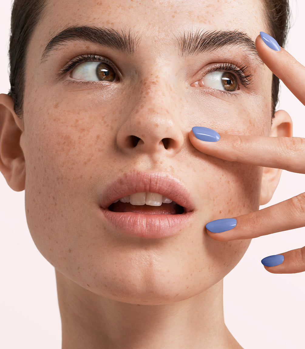 Manicured nails painted with Pink Gellac 476 Jolie Blue gel polish.