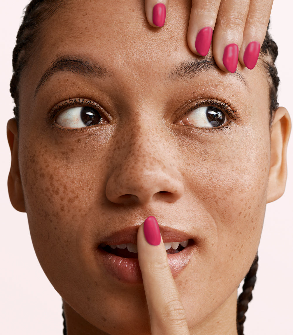 Manicured nails painted with Pink Gellac 477 Haute Magenta gel polish.