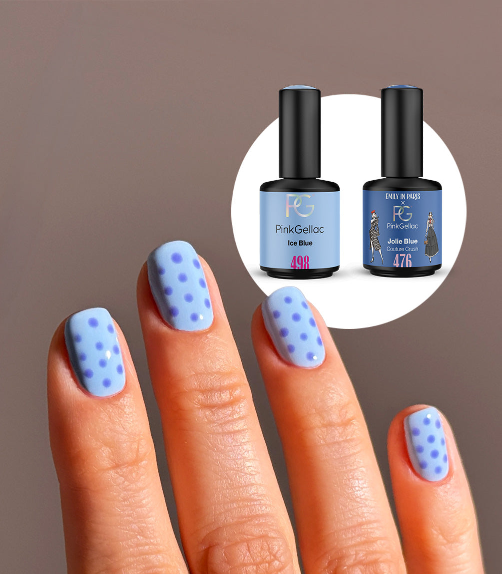 Hand with a polka dot manicure created with the Pink Gellac Ice Blue Polka Dot set.