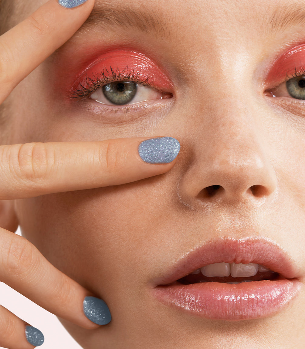 Manicured nails painted with Pink Gellac 489 Hologlaze Blue gel polish.