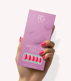 Hand holding Pink Gellac 161 Ibiza Pink press-on nails in their packaging.