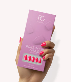 Hand holding Pink Gellac 161 Ibiza Pink press-on nails in their packaging.