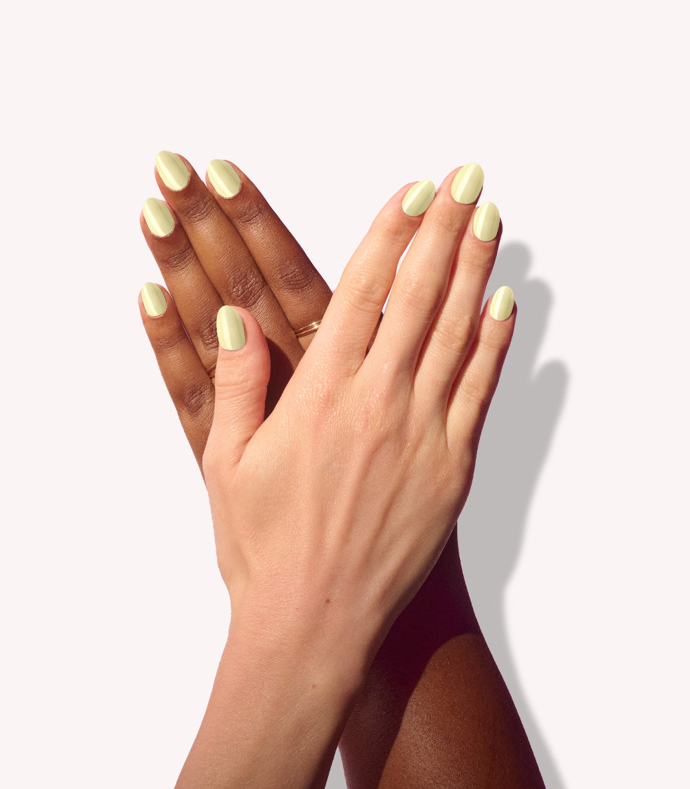 Two hands wearing Pink Gellac 487 Yummy Yellow press-on nails.