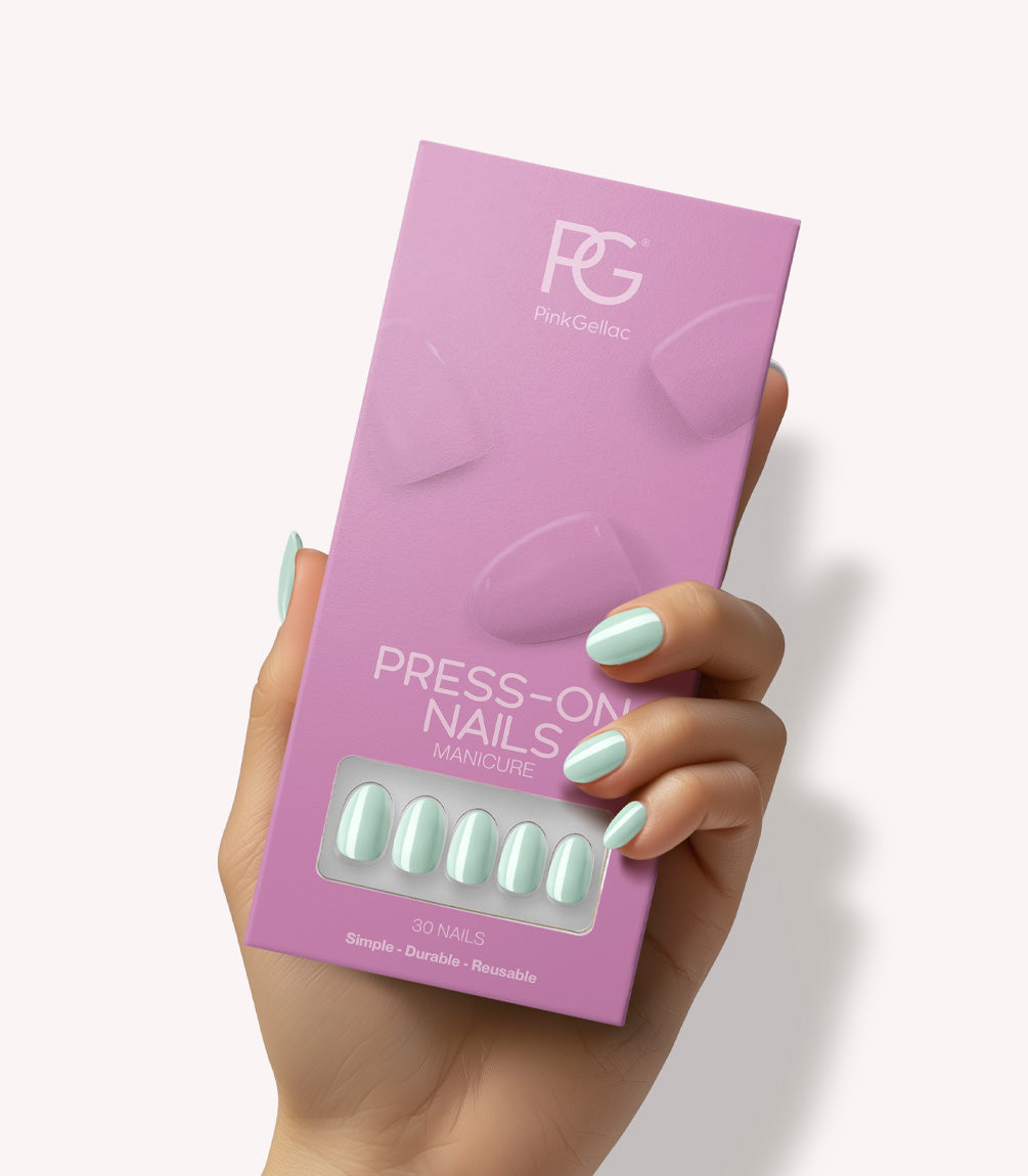 Hand holding Pink Gellac 488 Melted Mint press-on nails in their packaging.