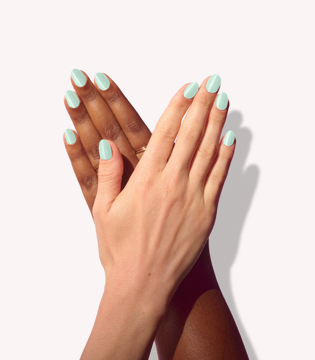 Two hands wearing Pink Gellac 488 Melted Mint press-on nails.